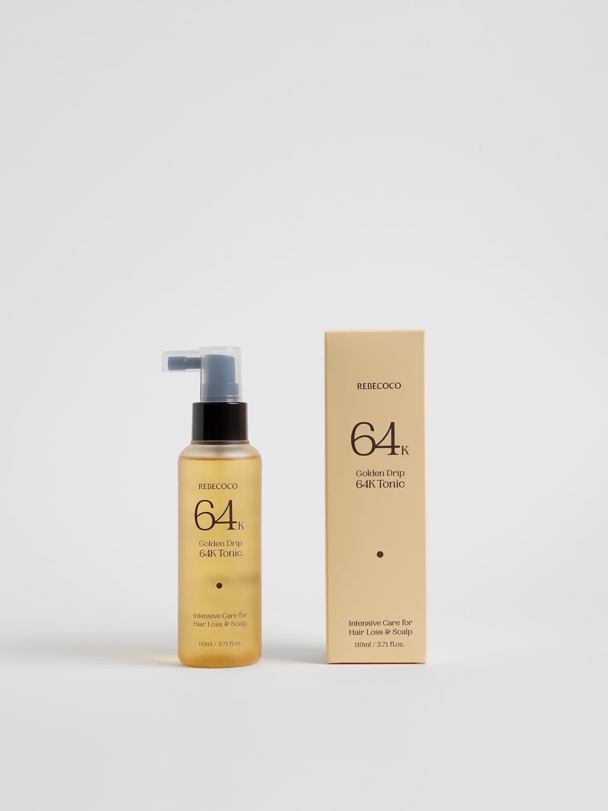 REBECOCO Golden Drip 64K Korean scalp care leave-in tonic bottle, 110ml, beside its carton